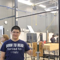 A student holding a short sword.
